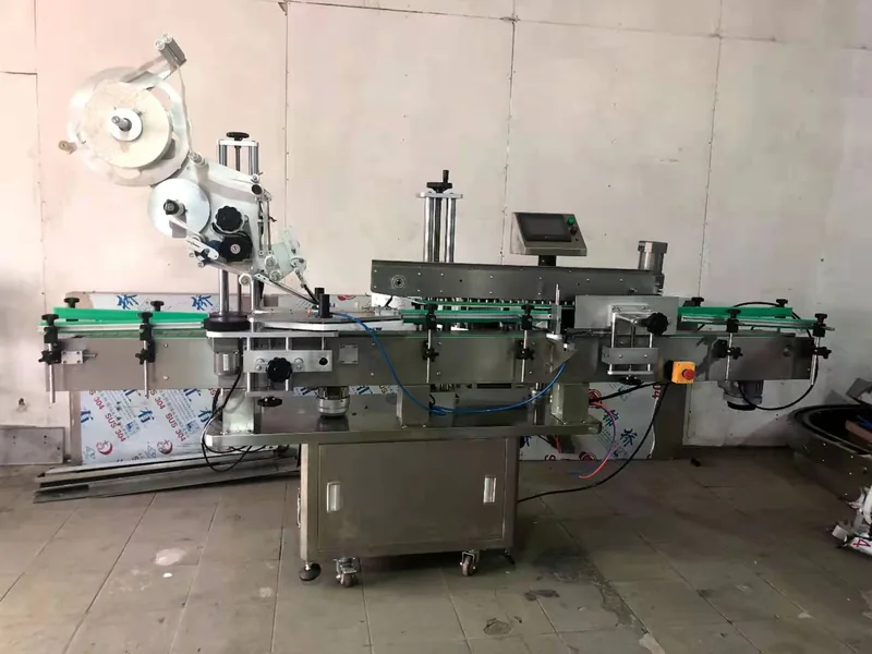 Company-owned photo of flat side combination labeling machine company view, catalog view 124.