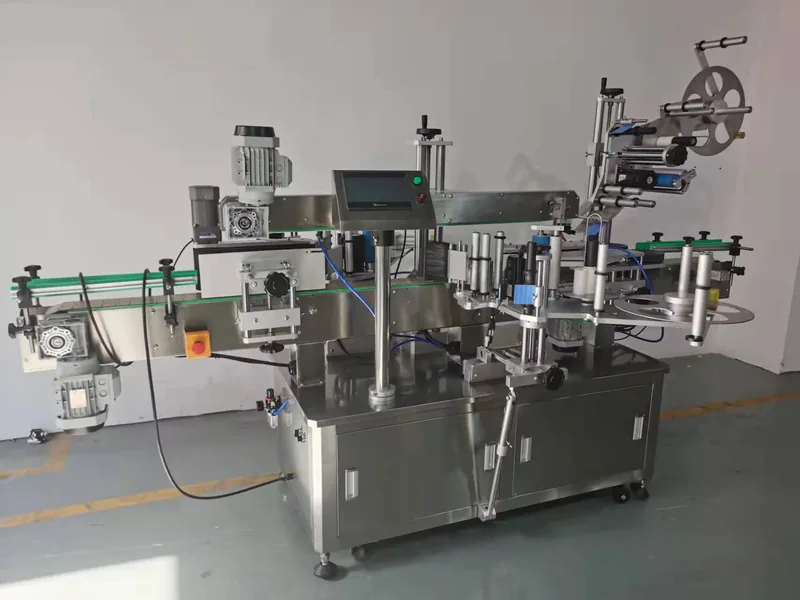 Company-owned photo of flat side round bottle combination labeling machine company view, catalog view 123.