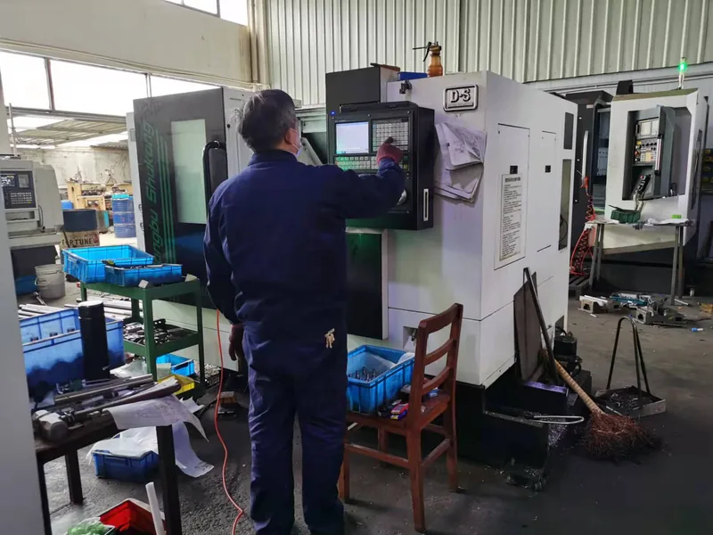 Company-owned photo of labeling machine factory cnc technician operating machine-01, catalog view 029.