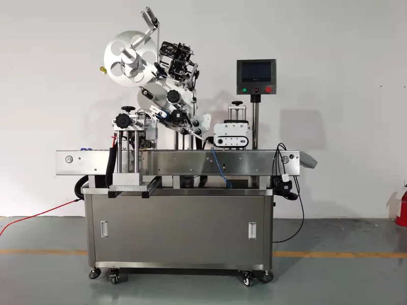 Company-owned photo of vision guided vial labeling machine company view, catalog view 091.